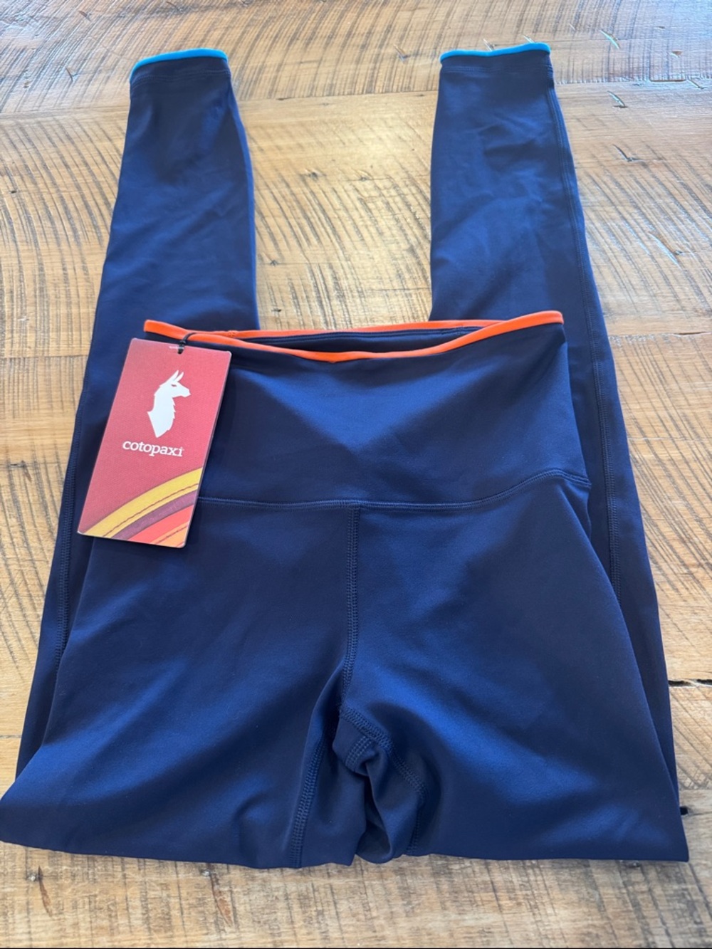 NEW Cotopaxi Mari tight Navy Leggings with Orange and Teal Trim